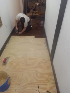 man doing floor installation